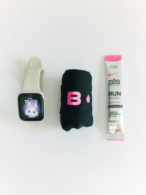 Rolled B.Peachy reusable pad alongside running essentials